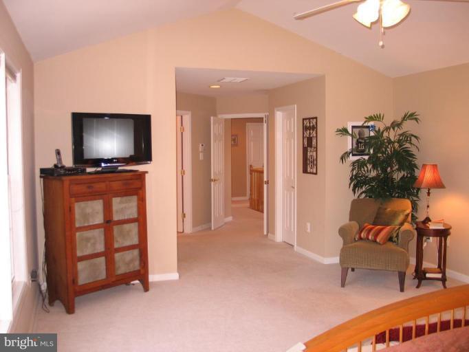 3648 Valley Road Ellicott City, MD 21042 - Photo 15 of 30 a living room with furniture and a flat screen tv