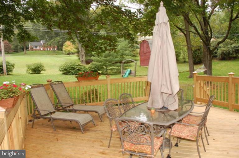 3648 Valley Road Ellicott City, MD 21042 - Photo 3 of 30 a view of a outdoor space with furniture and garden