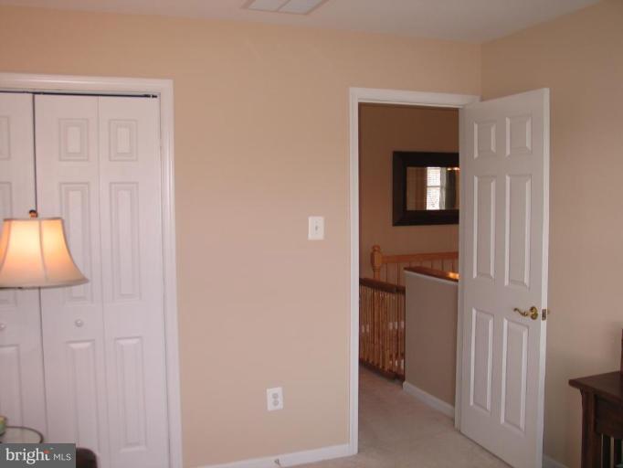 3648 Valley Road Ellicott City, MD 21042 - Photo 24 of 30 a view of a closet area with ceiling fan