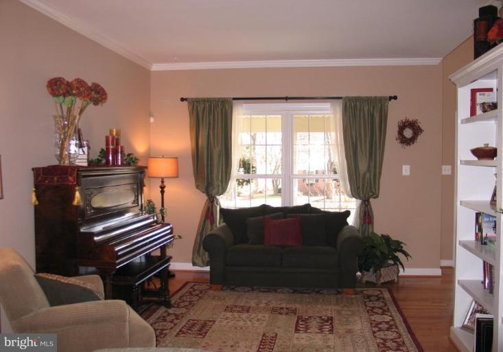 3648 Valley Road Ellicott City, MD 21042 - Photo 9 of 30 a living room with furniture and wooden floor