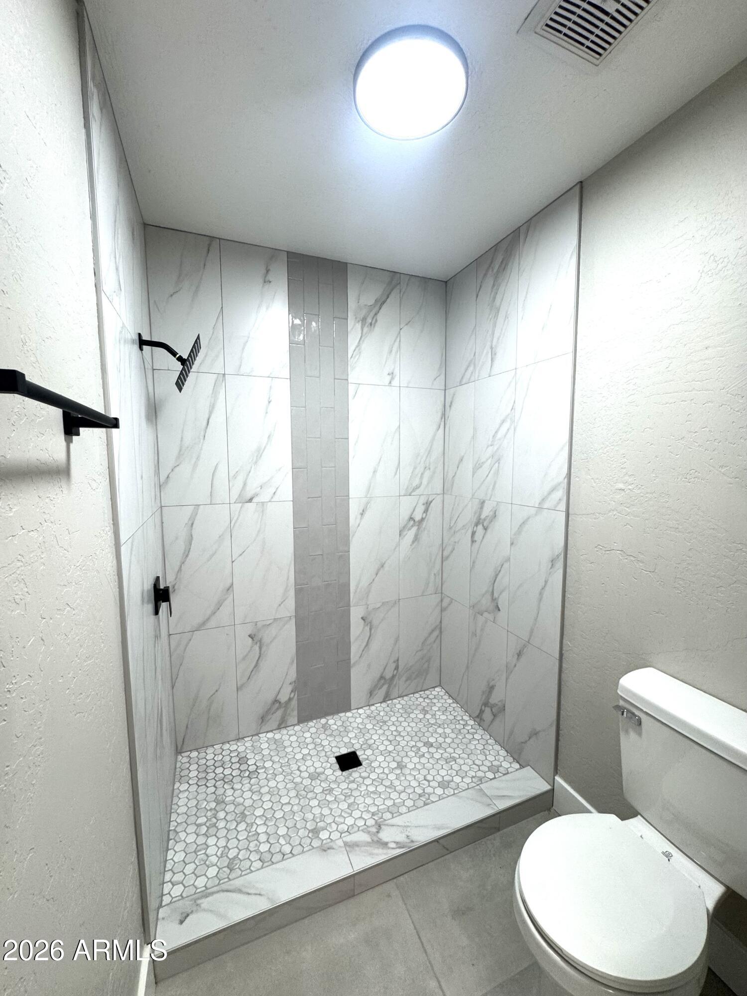 2003 North 51st Way Phoenix, AZ 85008 - Photo 20 of 22 a bathroom with a toilet and shower