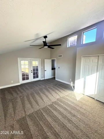 a view of an empty room with a window