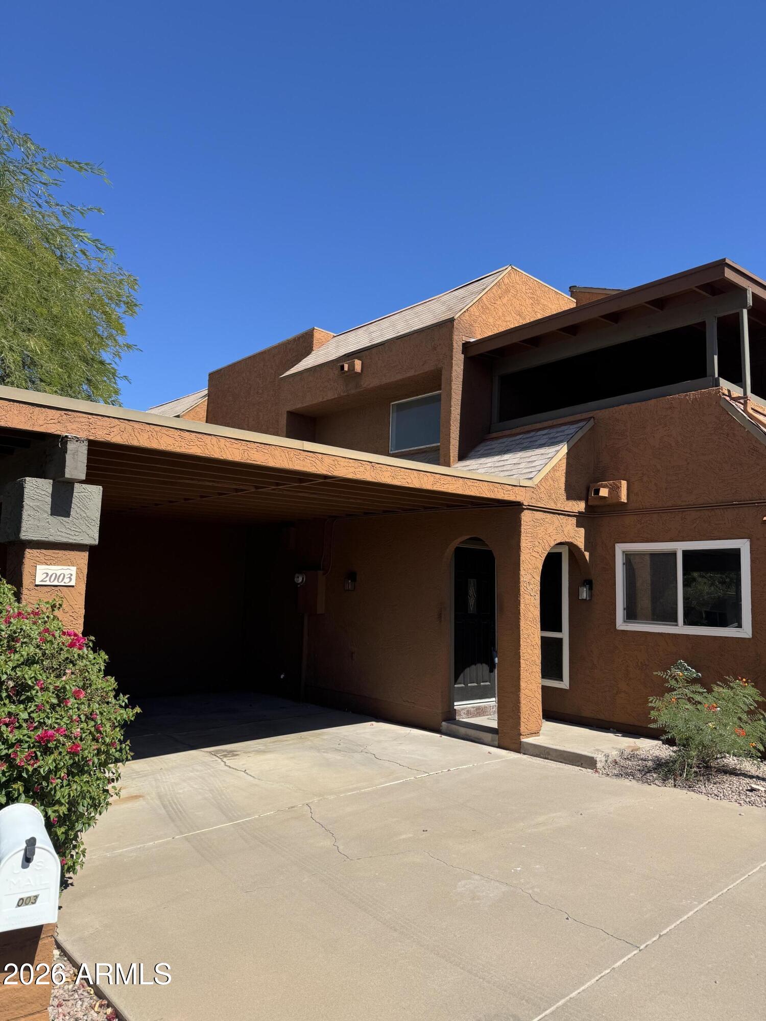 2003 North 51st Way Phoenix, AZ 85008 - Photo 3 of 22 a front view of a house with a yard
