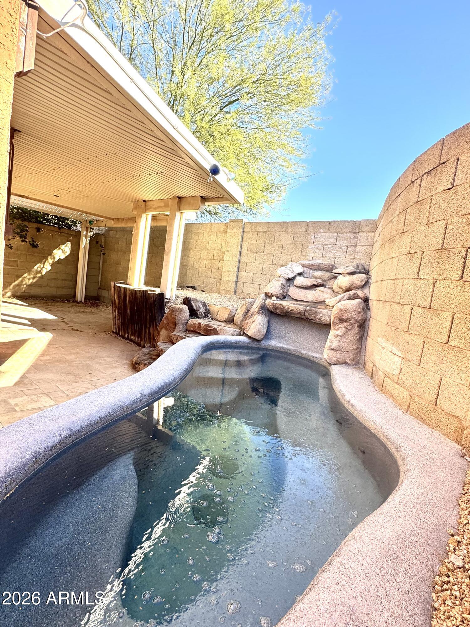 2003 North 51st Way Phoenix, AZ 85008 - Photo 4 of 22 a view of a swimming pool with a lounge chairs