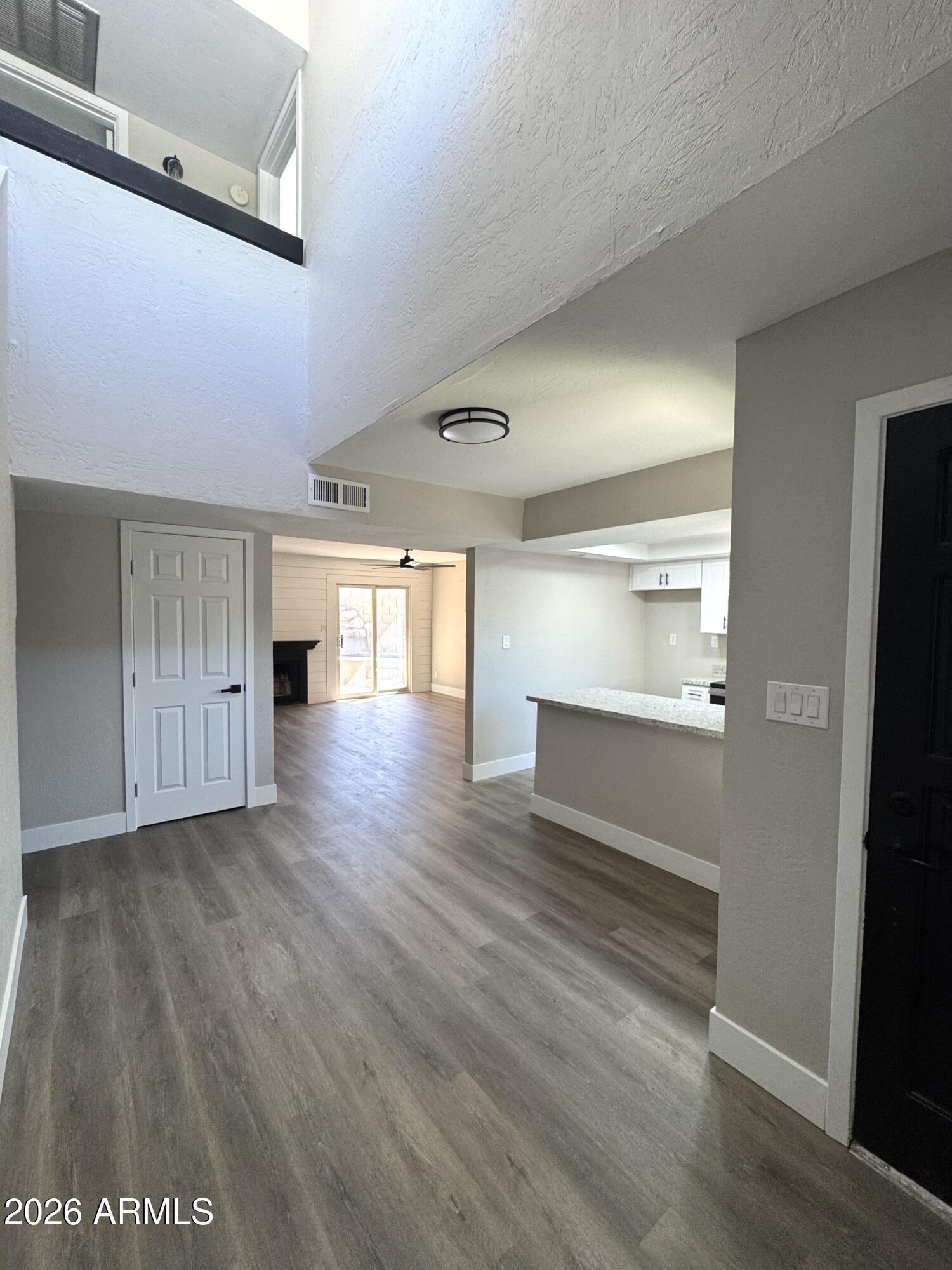 2003 North 51st Way Phoenix, AZ 85008 - Photo 7 of 22 a view of empty room with wooden floor