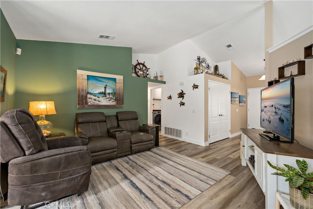 31141 Vía Gilberto Temecula, CA 92592 - Photo 12 of 39 a living room with furniture and a flat screen tv