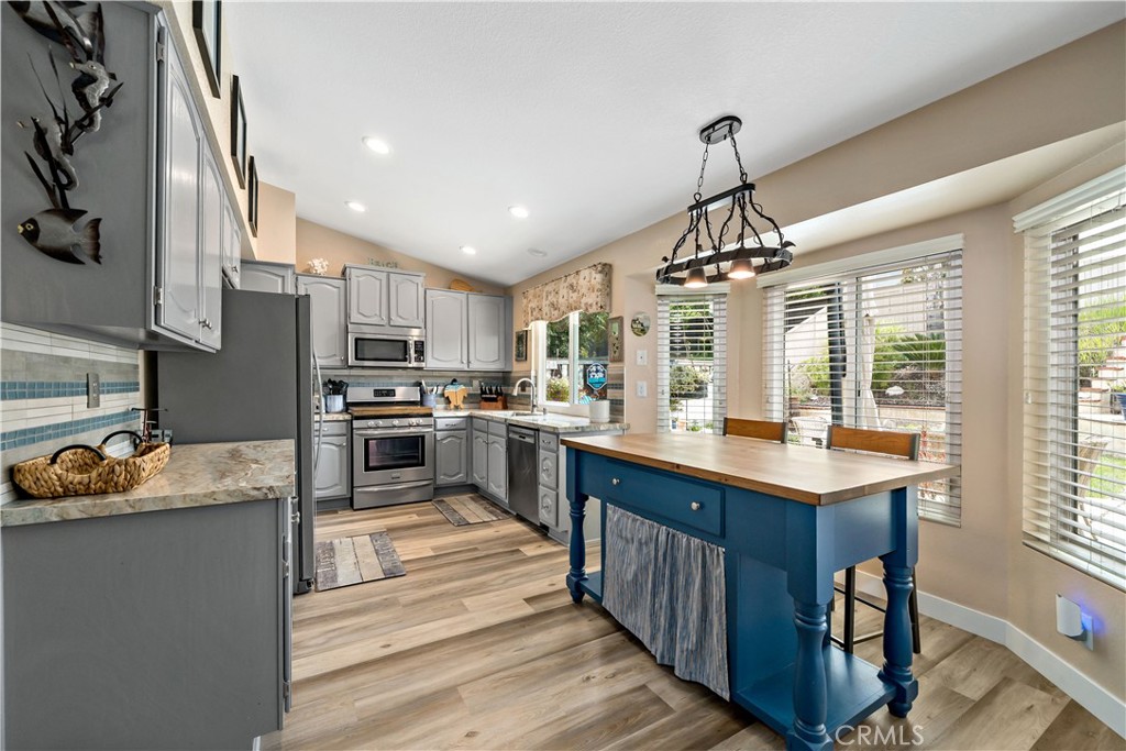 31141 Vía Gilberto Temecula, CA 92592 - Photo 14 of 39 a kitchen with a sink refrigerator and cabinets