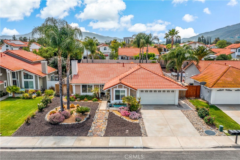 31141 Vía Gilberto Temecula, CA 92592 - Photo 2 of 39 a front view of a house with garden