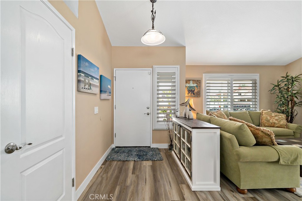 31141 Vía Gilberto Temecula, CA 92592 - Photo 4 of 39 a living room with furniture and a floor to ceiling window