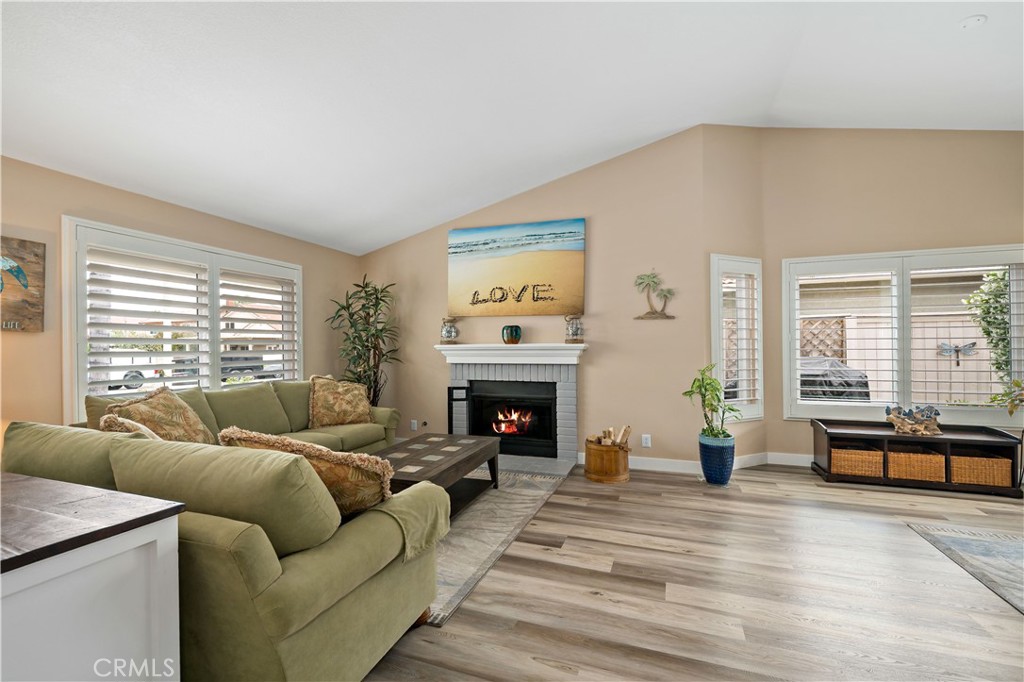 31141 Vía Gilberto Temecula, CA 92592 - Photo 6 of 39 a living room with furniture large window and a fireplace