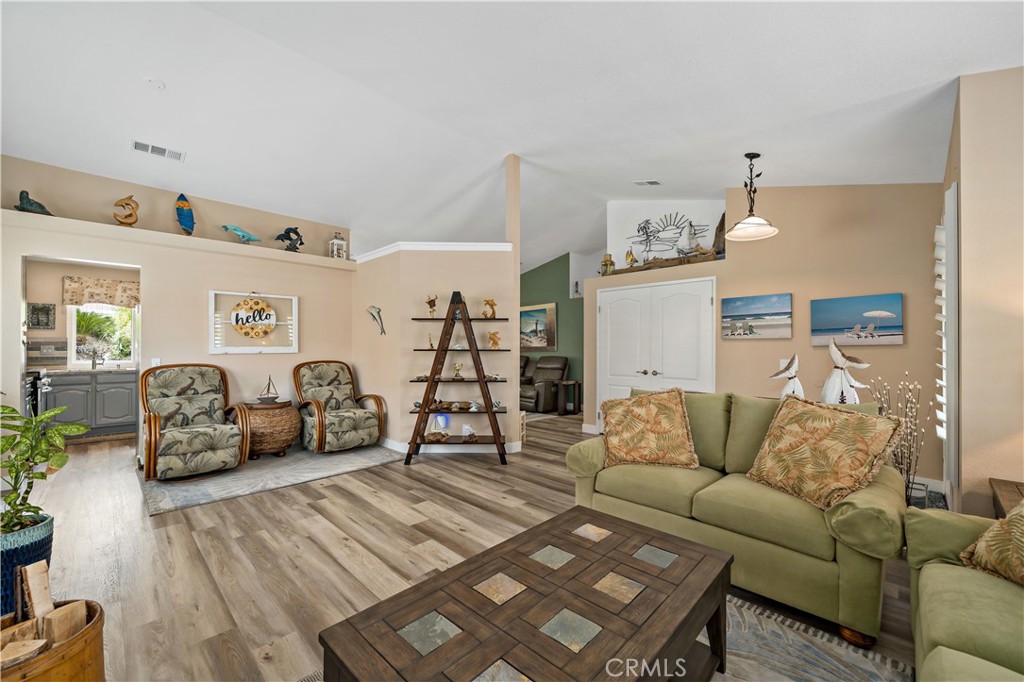 31141 Vía Gilberto Temecula, CA 92592 - Photo 7 of 39 a living room with furniture and wooden floor