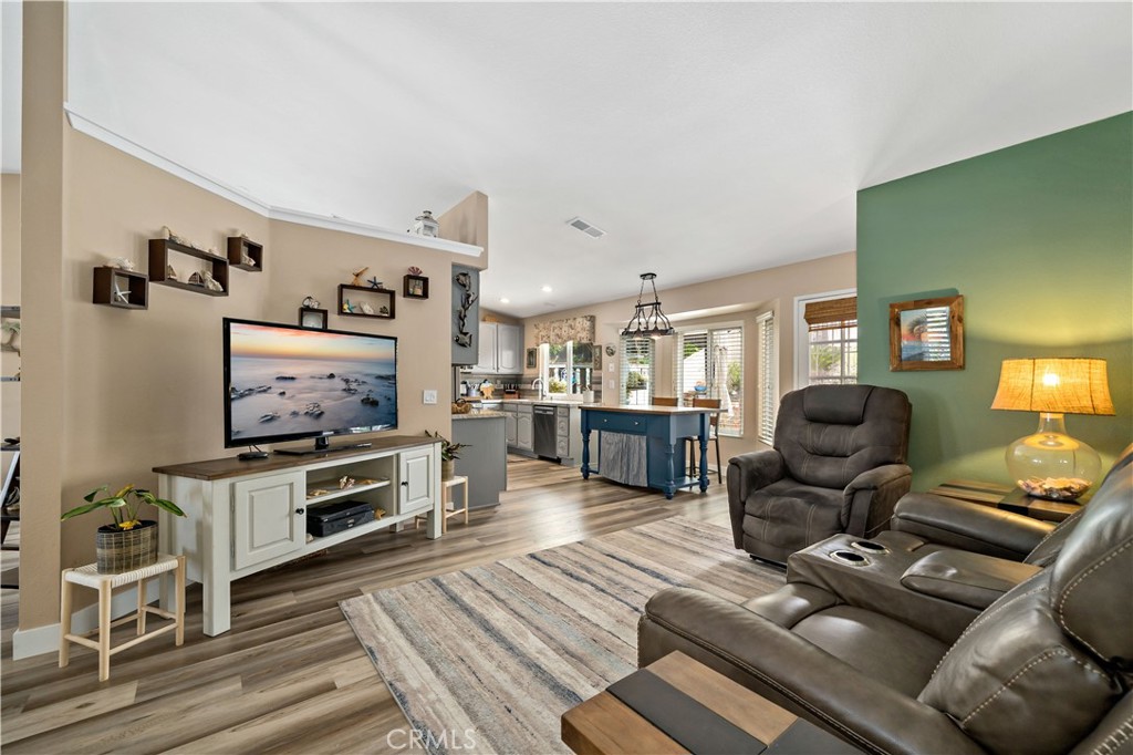 31141 Vía Gilberto Temecula, CA 92592 - Photo 10 of 39 a living room with furniture a flat screen tv and kitchen view