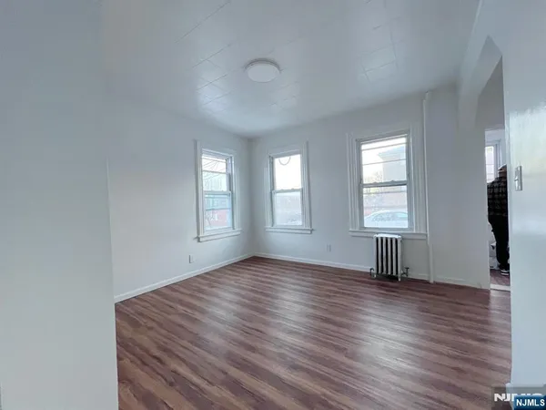 a bathroom with a granite countertop sink a toilet and bathtub