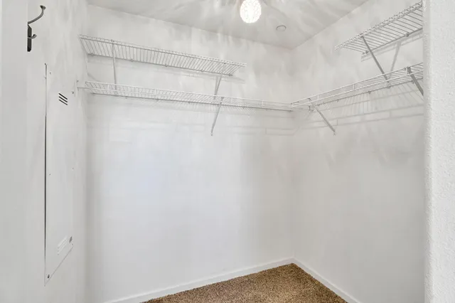 a view of a back yard from a corridor