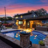a view of a patio with couches chairs and a potted plant