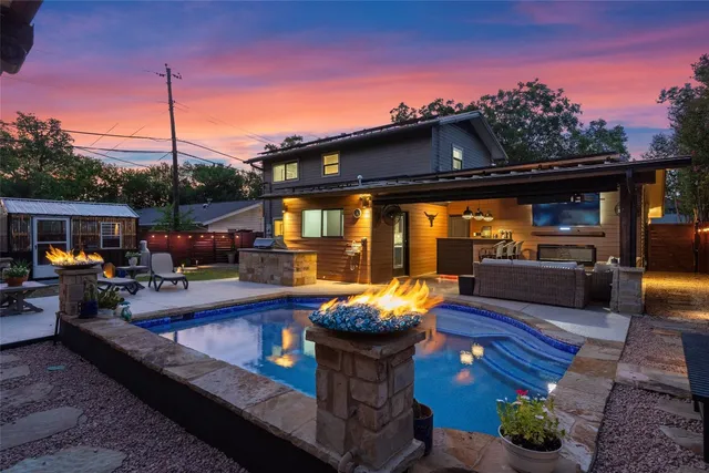 a view of a patio with couches chairs and a fire pit