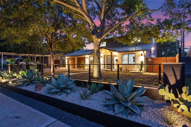 a view of a house with a wooden deck