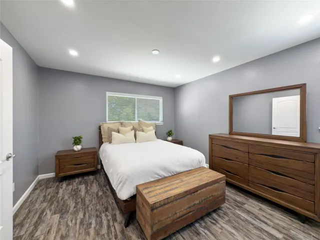 a bed room with a bed and window