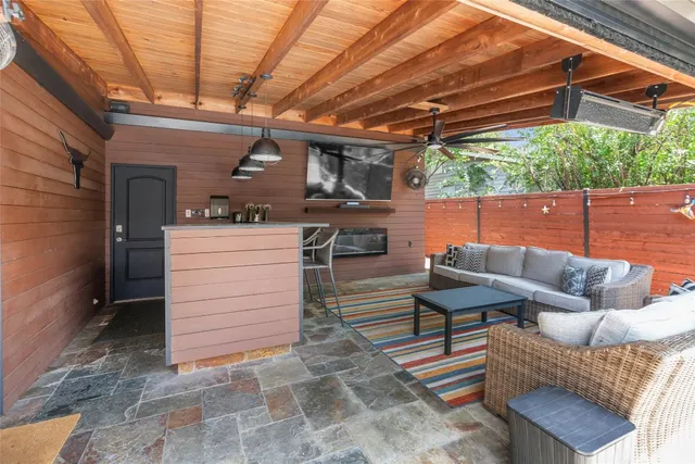 a view of a chairs and table in the patio