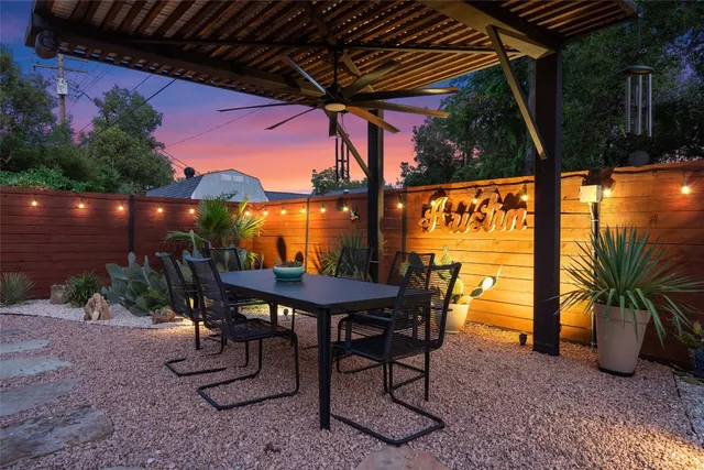 a view of a chairs and table in patio