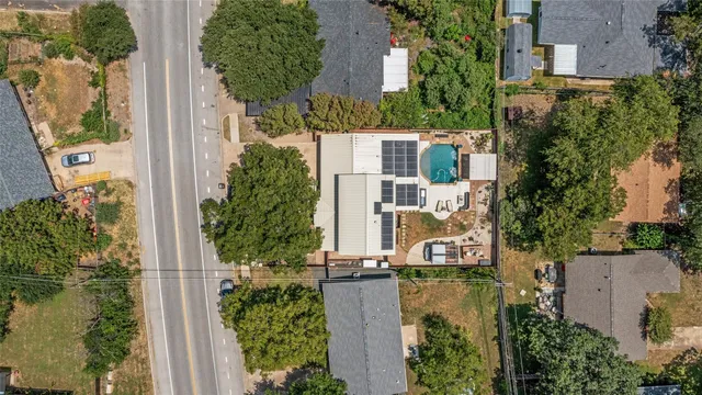 an aerial view of a house with outdoor space