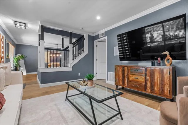 a living room with furniture a fireplace and window