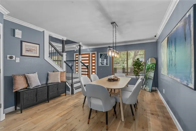 a view of a dining room with furniture window and wooden floor