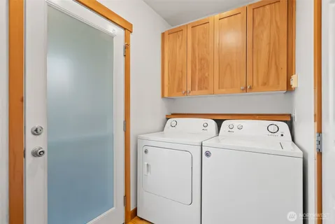 a view of storage and utility room with washer and dryer