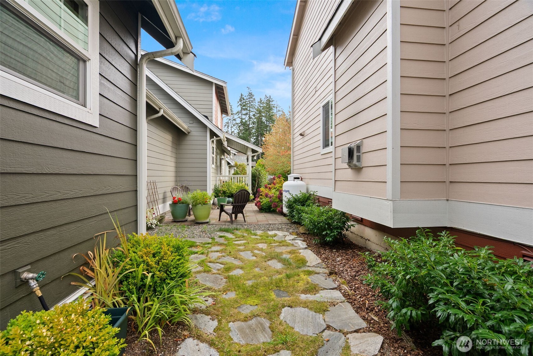 1322 Polly's Lane Bainbridge Island, WA 98110 - Photo 18 of 21 a view of a chair and table in the backyard