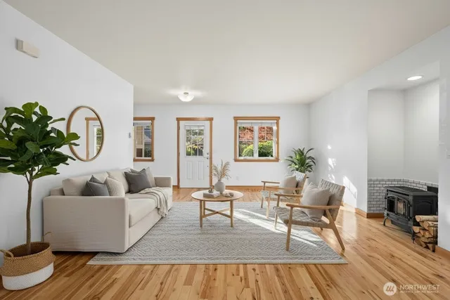 a living room with furniture and a potted plant