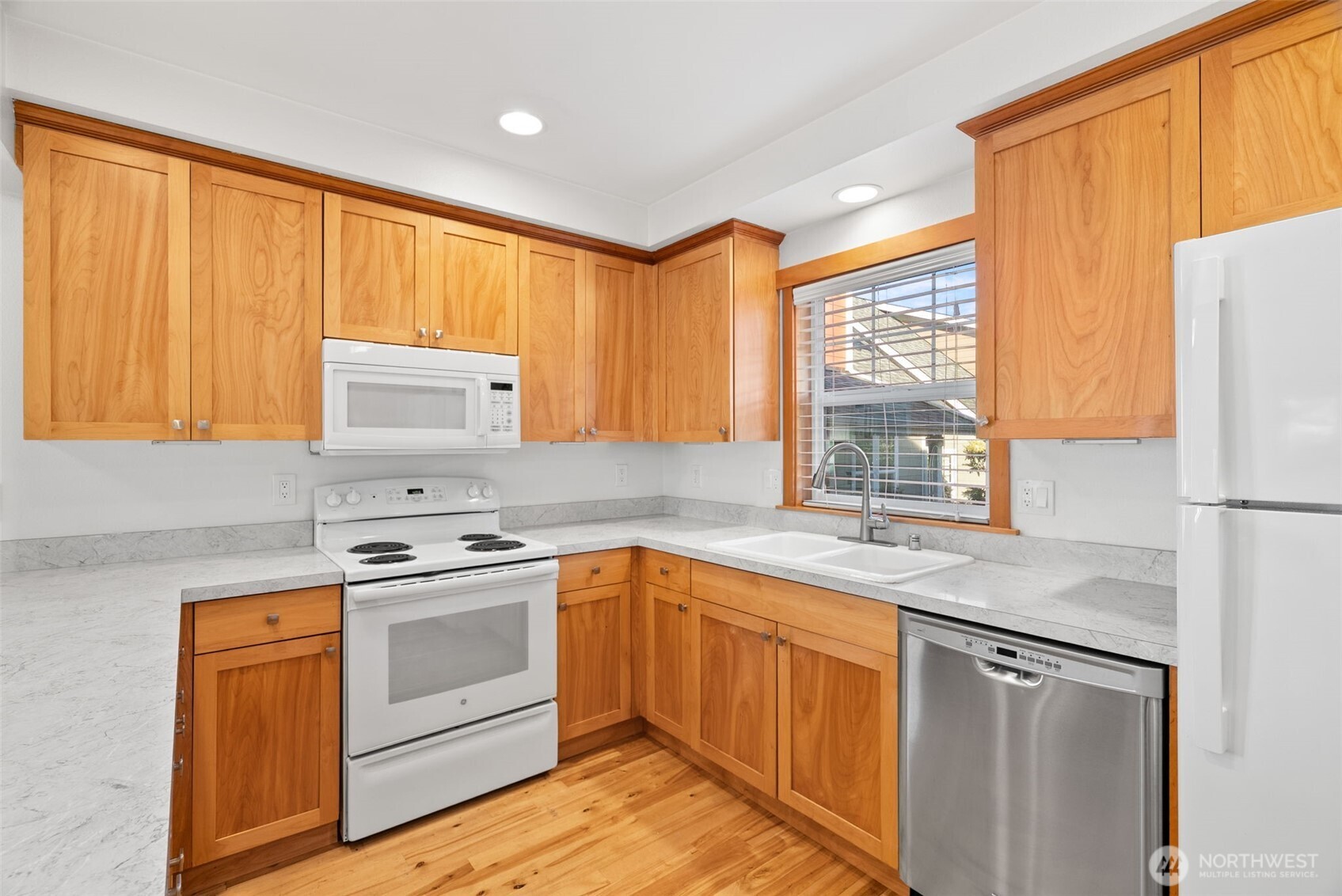 1322 Polly's Lane Bainbridge Island, WA 98110 - Photo 9 of 21 a kitchen with a sink stove and refrigerator