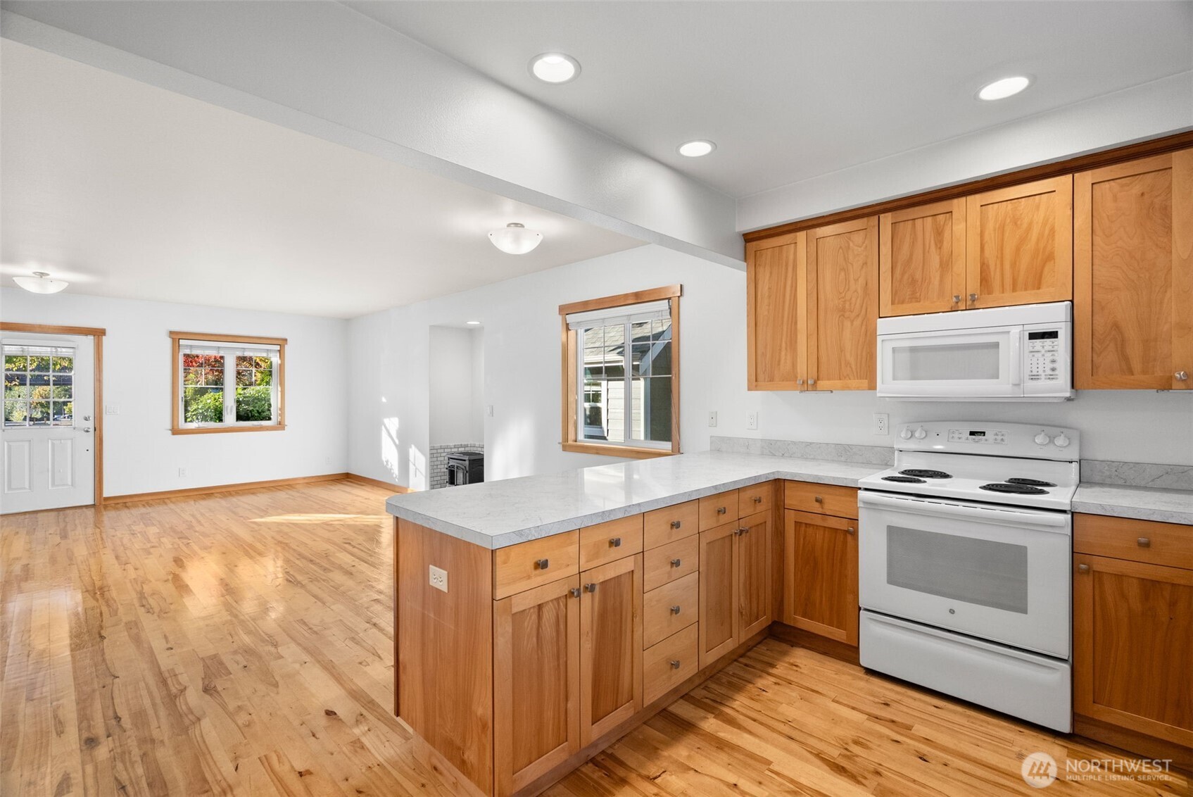 1322 Polly's Lane Bainbridge Island, WA 98110 - Photo 10 of 21 a kitchen with a stove window and cabinets
