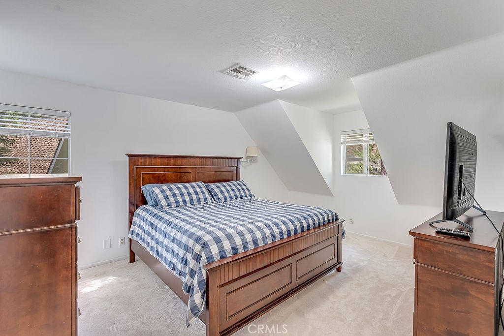 318 Old Toll Road Lake Arrowhead, CA 92352 - Photo 11 of 44 a bedroom with a bed and a flat screen tv