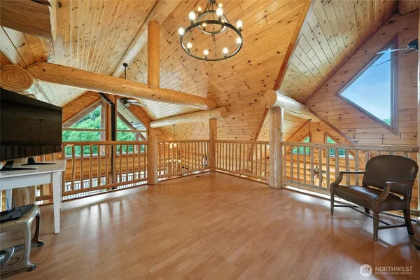 a view of an entryway with wooden floor