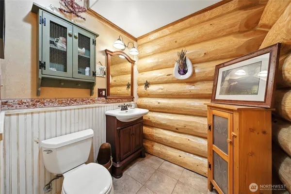 a bathroom with a toilet and a sink