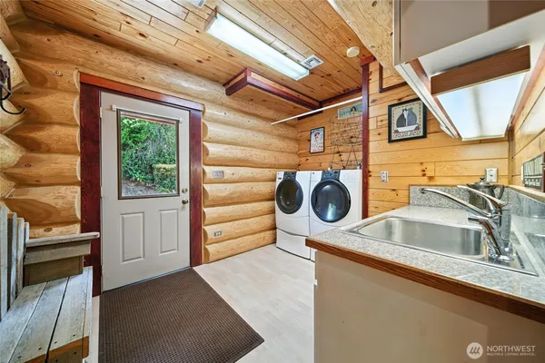 a utility room with dryer and washer