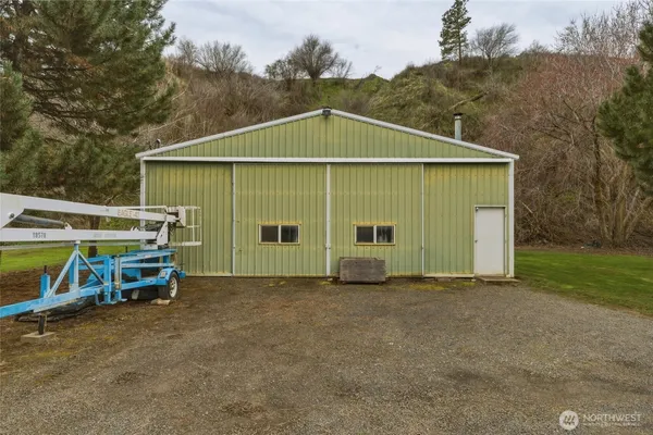 a view of a house with a yard and garage