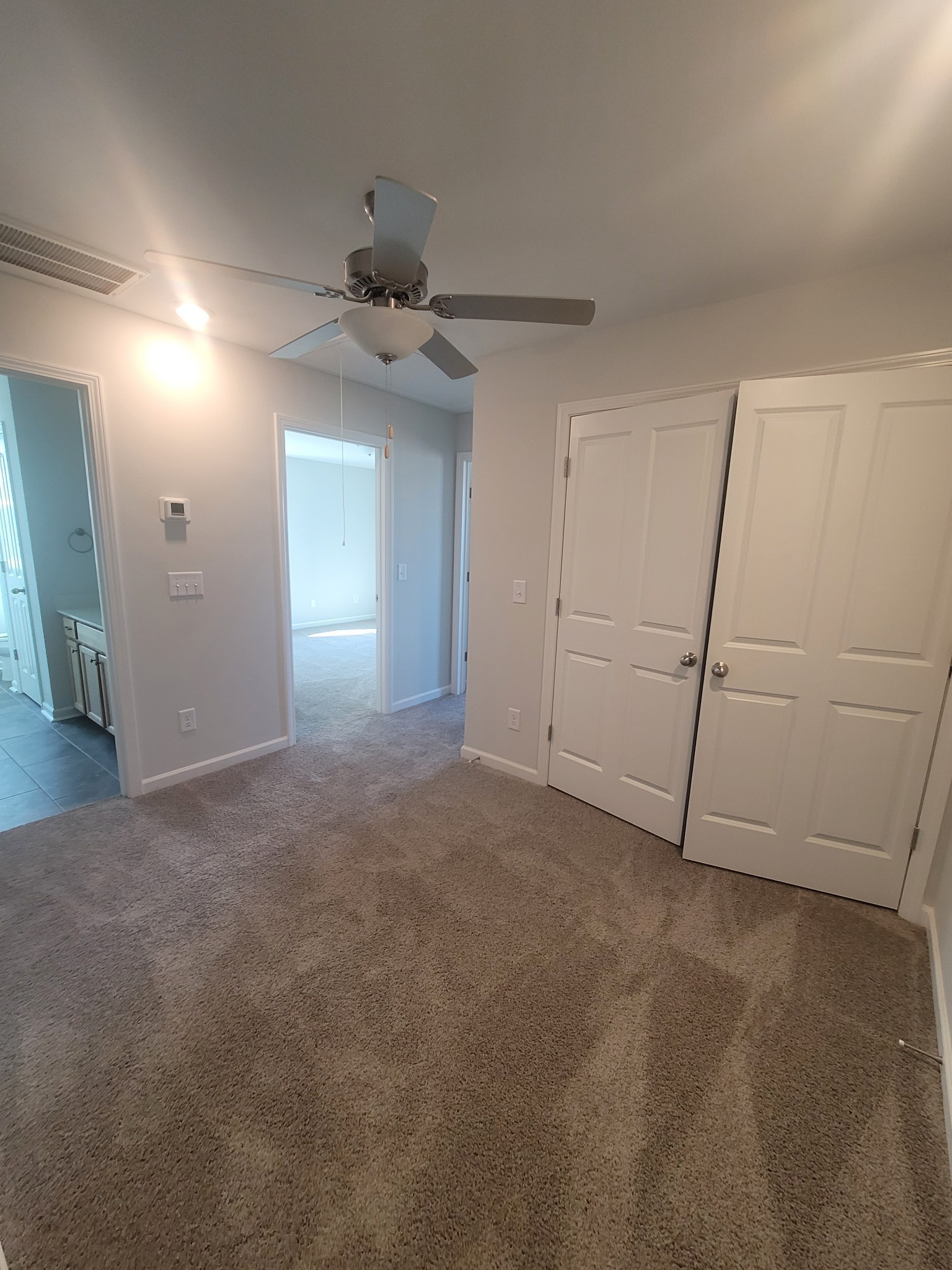 504 Gilroy Court Antioch, TN 37013 - Photo 12 of 17 a view of an empty room and a chandelier fan