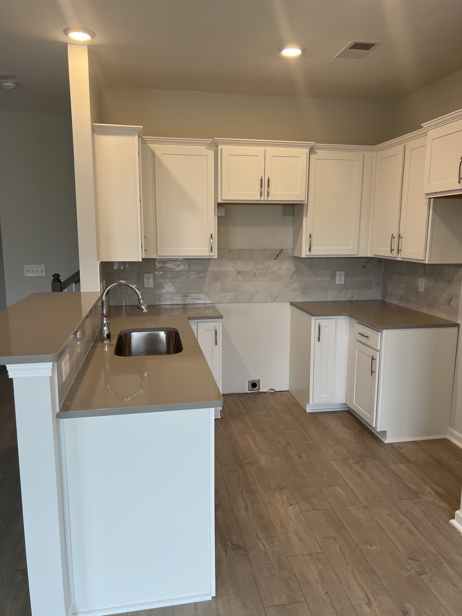 504 Gilroy Court Antioch, TN 37013 - Photo 3 of 17 a kitchen with a sink stove and cabinets