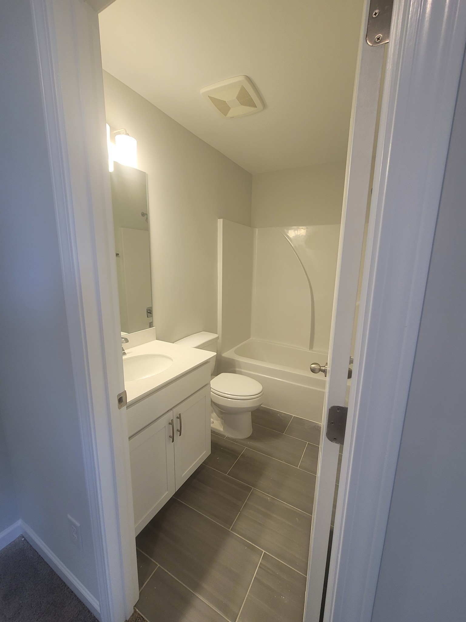 504 Gilroy Court Antioch, TN 37013 - Photo 9 of 17 a bathroom with a granite countertop sink toilet and shower