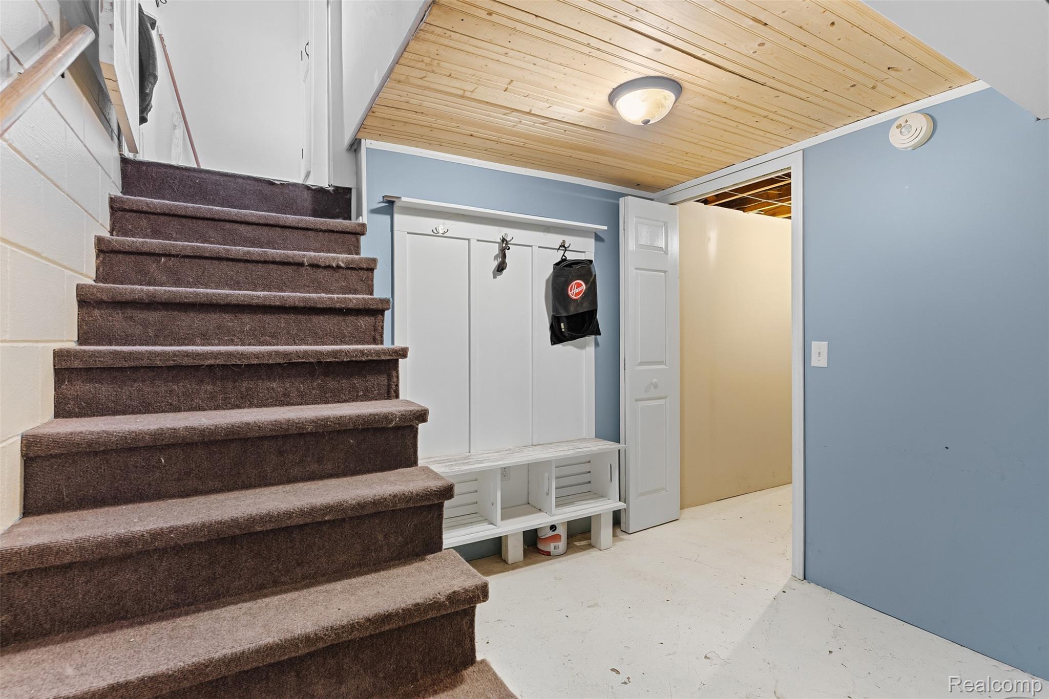 7230 North Center Road Mount Morris, MI 48458 - Photo 21 of 33 Mudroom featuring wooden ceiling and unfinished concrete flooring