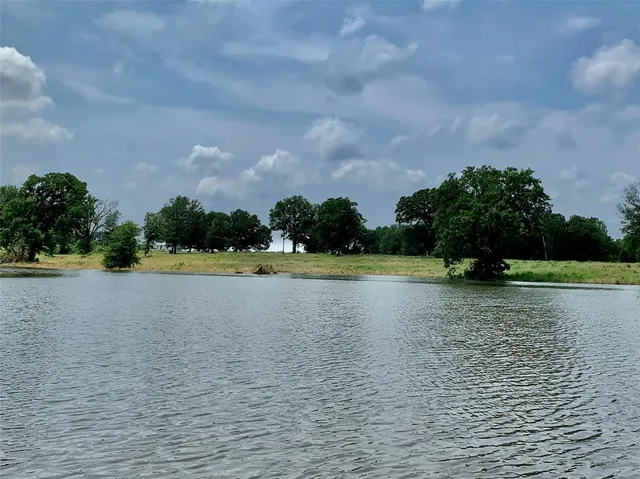 a view of a swimming pool and a yard