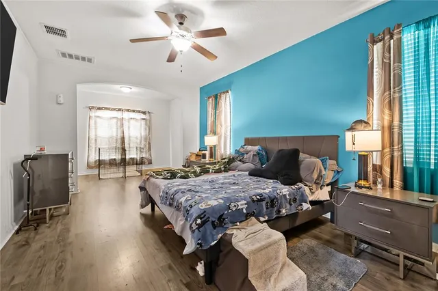 a bed room with bed and window