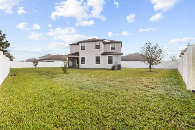 a view of a house with a big yard