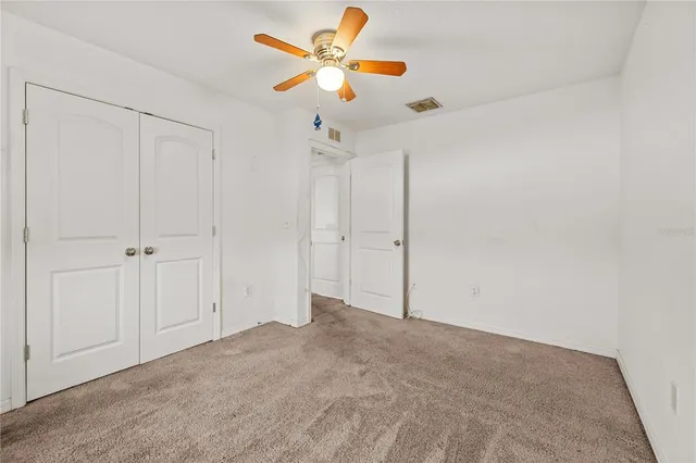 a view of a chandelier fan in a room