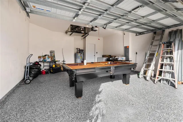 a room with lots of furniture and air hockey table