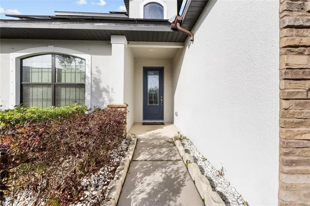 a view of a brick house with windows