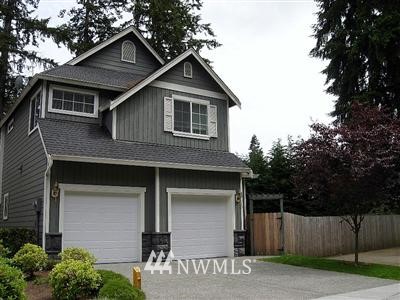 17125 3rd Place West Bothell, WA 98012 - Photo 1 of 1 a front view of a house with a garden