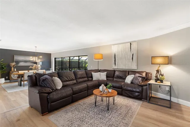 a living room with furniture and a lamp