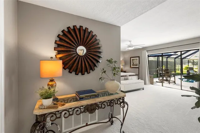 a bathroom with a granite countertop toilet sink and mirror